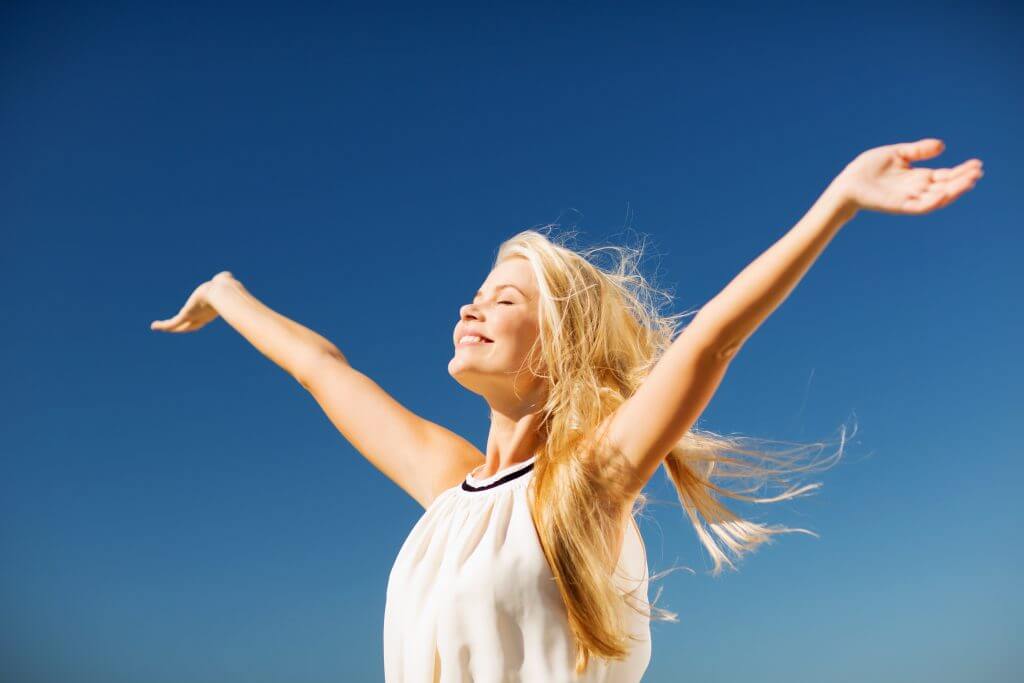 woman standing in sun